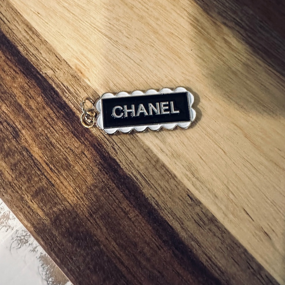 CHANEL Black and Silver Logo Charm